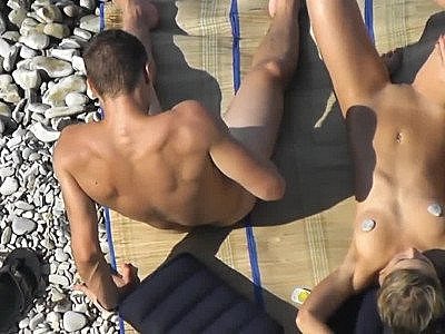 Buddy Jerks dick before her girlfriend at a public beach