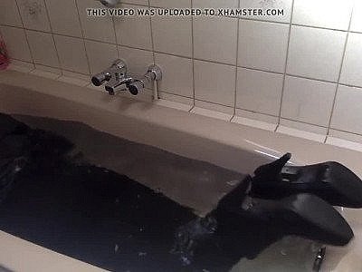 Sexy tight pants ankle boots and heels in bath